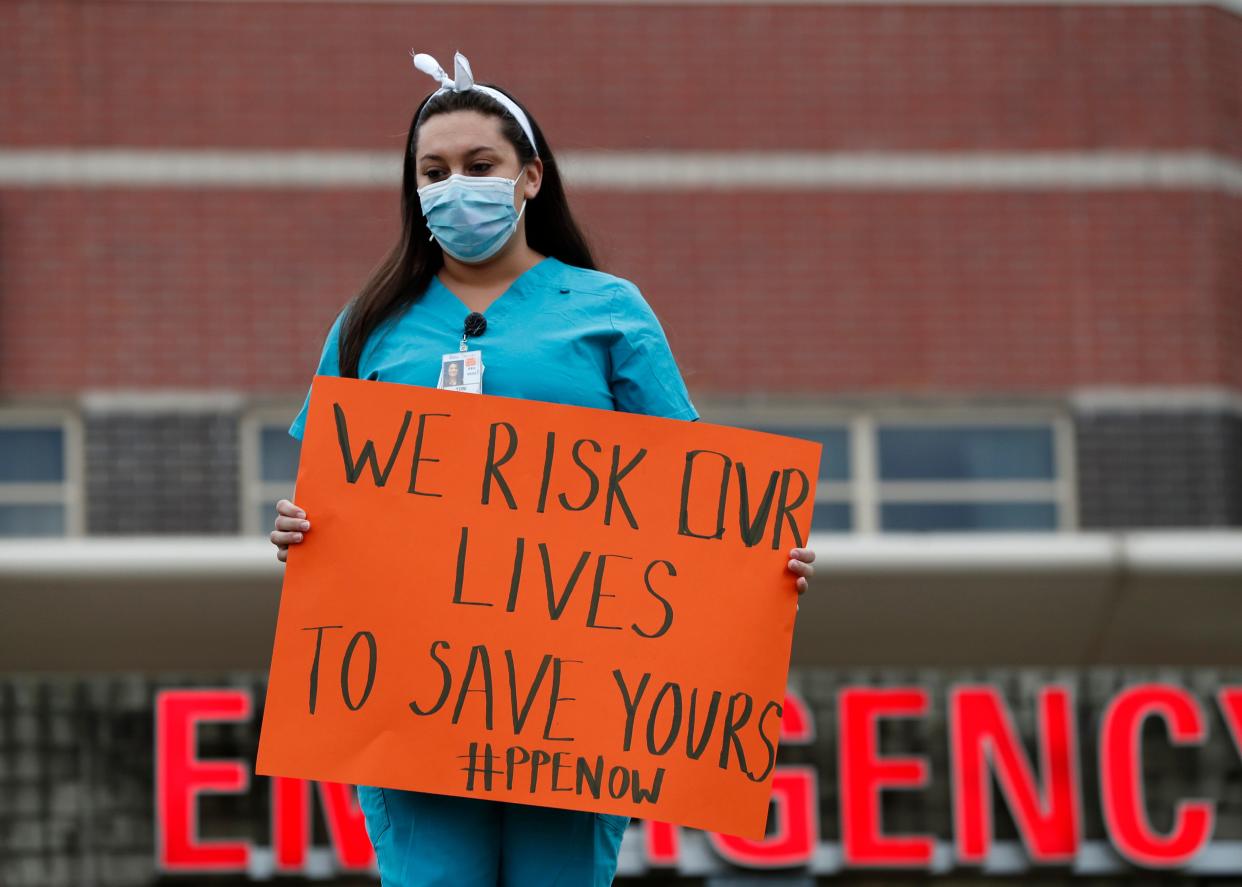 A nurse demonstrates outside the emergency entrance at Jacobi Medical Center in the Bronx borough of New York on March 28, demanding more personal protective equipment for medical staff treating coronavirus patients.  (Kathy Willens/ASSOCIATED PRESS)