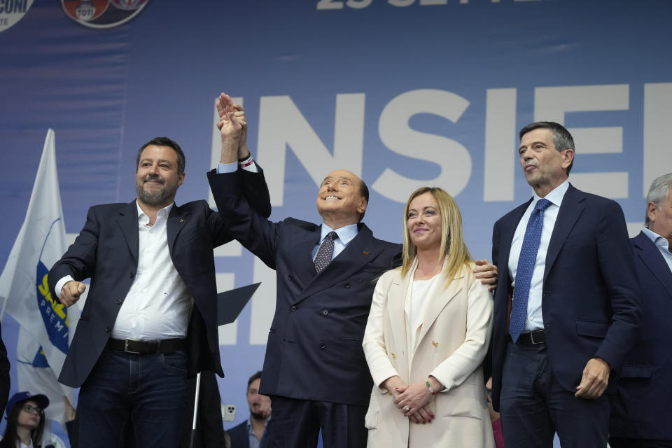 FILE - From left, The League's Matteo Salvini, Forza Italia's Silvio Berlusconi, Brothers of Italy's Giorgia Meloni, and Noi Con l'Italia's Maurizio Lupi, attend the center-right coalition closing rally in Rome ahead of Italy's general elections, Thursday, Sep. 22, 2022. When Giorgia Meloni took office a year ago as the first far-right premier in Italy's post-war history, concern was palpable abroad about the prospect of democratic backsliding and resistance to European Union rules. But since being sworn in as premier on Oct. 22, 2022, Meloni has confounded Western skeptics. (AP Photo/Gregorio Borgia, File)