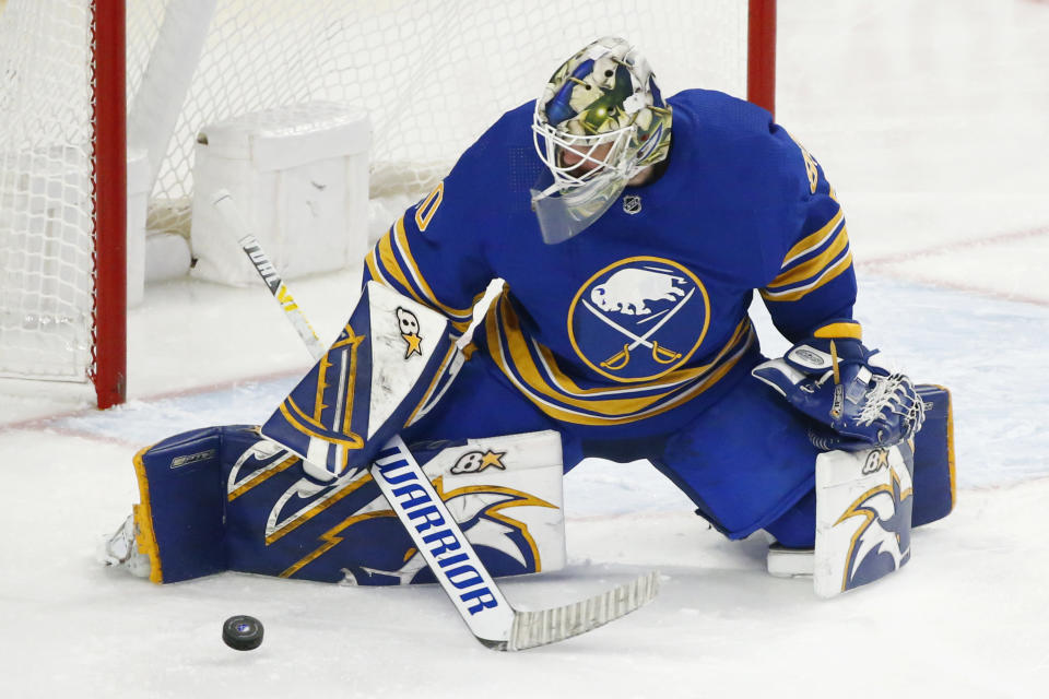 Buffalo Sabres goaltender Aaron Dell (80) makes a pad save during the third period of an NHL hockey game against the Detroit Red Wings, Monday, Jan. 17, 2022, in Buffalo, N.Y. (AP Photo/Jeffrey T. Barnes)