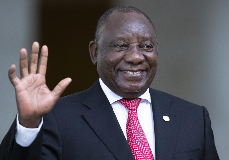 South Africa's President Cyril Ramaphosa greets the media prior to a meeting of leaders of the BRICS emerging economies at the Itamaraty palace in Brasilia, Brazil, Thursday, Nov. 14, 2019. (AP Photo/Pavel Golovkin, Pool)