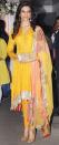 Deepika looks stunning in this yellow asymmetrical anarkali. It’s a great look for a mehendi function as the colours work best for it.