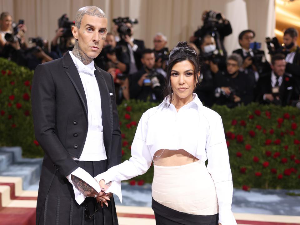 Travis Barker and Kourtney Kardashian attend the 2022 Met Gala.