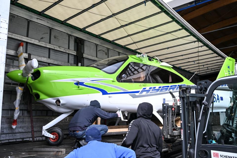 <div class="inline-image__caption"><p>The P2010 H3PS hybrid electric aircraft from Italian aircraft manufacturer Tecnam is hoisted by a forklift to be assembled in an exhibition hall.</p></div> <div class="inline-image__credit">Photo by Felix Kästle/picture alliance via Getty</div>
