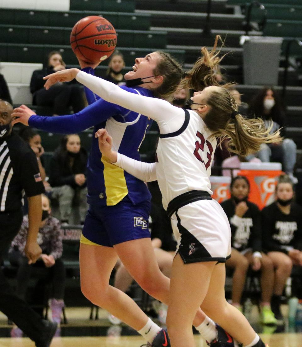 Maine-Endwell's Kaety L'Amoreaux goes up for a layup as Elmira's Ellie Clearwater defends  during the STAC girls basketball championship game Feb. 18, 2022 at Elmira High School.
