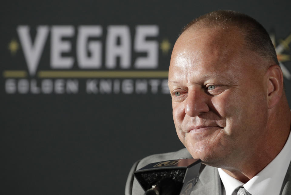 Gerard Gallant listens during a news conference Thursday, April 13, 2017, in Las Vegas. The Vegas Golden Knights have hired Gallant as the first coach of the NHL expansion team. (AP Photo/John Locher)