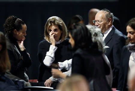 Mourners arrive for a memorial service for pharmaceutical billionaire Barry Sherman and his wife Honey, days after their mysterious deaths in Toronto, Ontario, Canada, December 21, 2017. REUTERS/ Mark Blinch