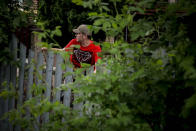 Michael Grunke looks out from his home to the streets around his neighborhood, where he has joined neighbors to form a watch group, after the death of George Floyd while in custody of police sparked unrest, Tuesday June 2, 2020, in Minneapolis, Minn. A week of civil unrest has led some Minneapolis residents near the epicenter of the violence to take steps to protect their homes and neighborhoods. (AP Photo/Bebeto Matthews)