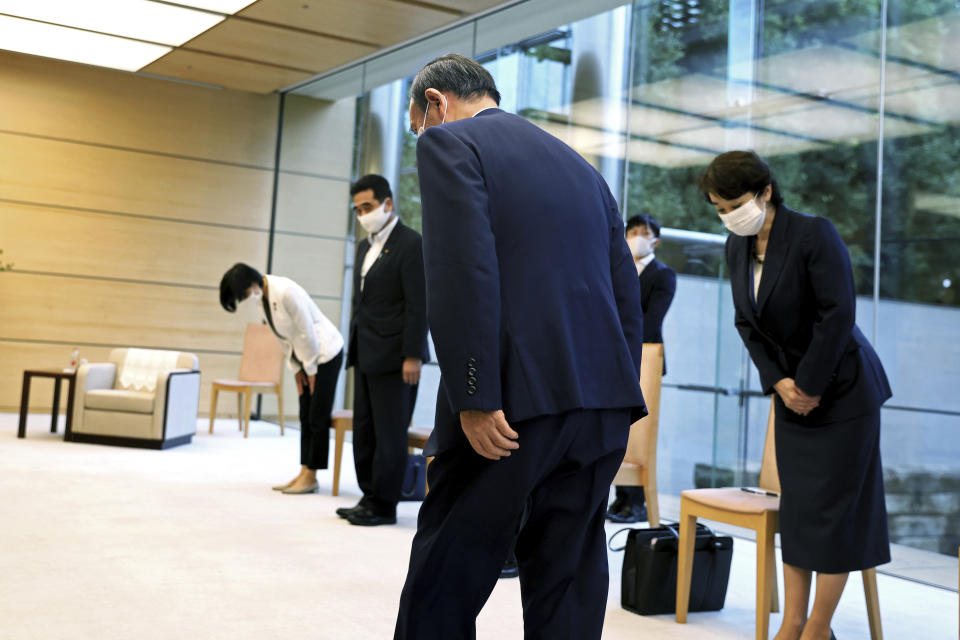 Japanese Primm Minister Yoshihide Suga arrives to meet International Paralympic Committee President Andrew Parsons, in Tokyo Friday, Sept.3, 2021. Suga said Friday he won’t run for leadership of the governing party at the end of this month, paving the way for a new Japanese leader after just a year in office. (Behrouz Mehri/Pool Photo via AP)