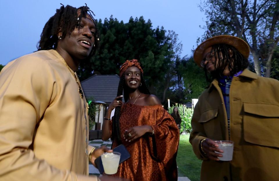 Saahene, center, at a fundraiser in Los Angeles for a Malawian charity.