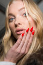 <p>Red-hot pointy nails. (Photo: Imaxtree) </p>