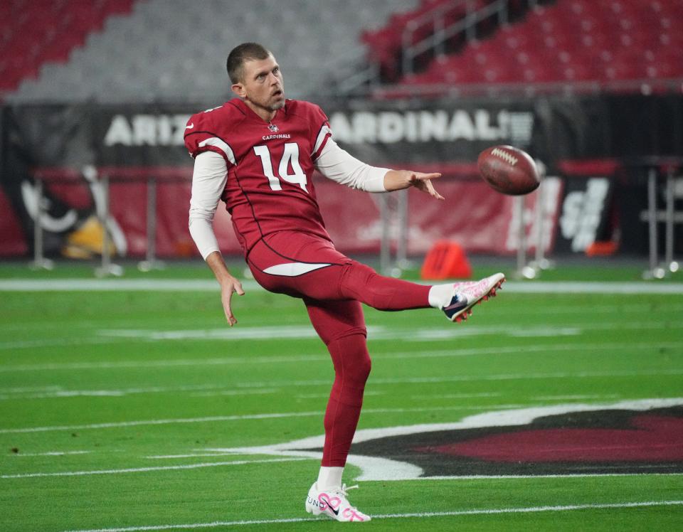 Dec 13, 2021; Glendale, Arizona, USA; Arizona Cardinals punter Andy Lee (14) warms up before Monday Night Football game against the Los Angeles Rams at State Farm Stadium.