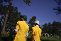 Spectators walk along the seventh fairway during the final round at the Masters golf tournament on Sunday, April 10, 2022, in Augusta, Ga. (AP Photo/Jae C. Hong)