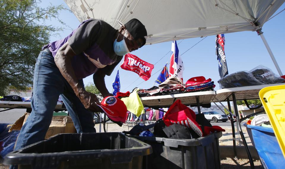 Mike Jackson sets up his concession area across from Dream City Church on Monday, June 22, 2020, in Phoenix. The church will host the Students for Trump convention, and a scheduled visit from President Donald Trump on Tuesday afternoon. (AP Photo/Ross D. Franklin)