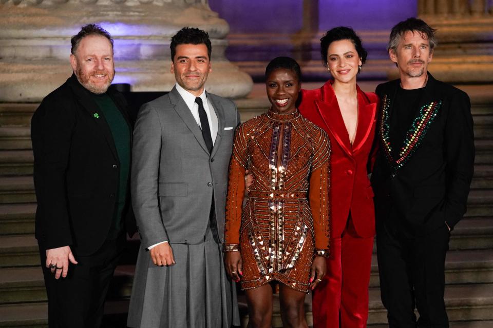 March 17, 2022 : (L-R) Irish actor David Ganly, US actor Oscar Isaac, British actor Ann Akinjirin, Egyptian actor May Calamawy and US actor Ethan Hawke pose on arrival to attend the Special Screening of Marvel Studios' Moon Knight at the British Museum, in London. 