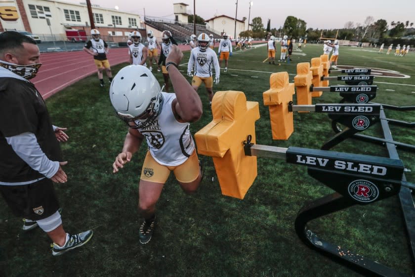 Encino, CA, Friday, February 26, 2021 - Crespi High School practices in pads for the first time since Covid-19 restrictions shut down interscholastic sports in California. (Robert Gauthier/Los Angeles Times)