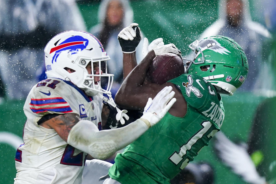 Philadelphia Eagles wide receiver Olamide Zaccheaus catches a touchdown pass over Buffalo Bills safety Jordan Poyer during the second half of an NFL football game Sunday, Nov. 26, 2023, in Philadelphia. (AP Photo/Chris Szagola)