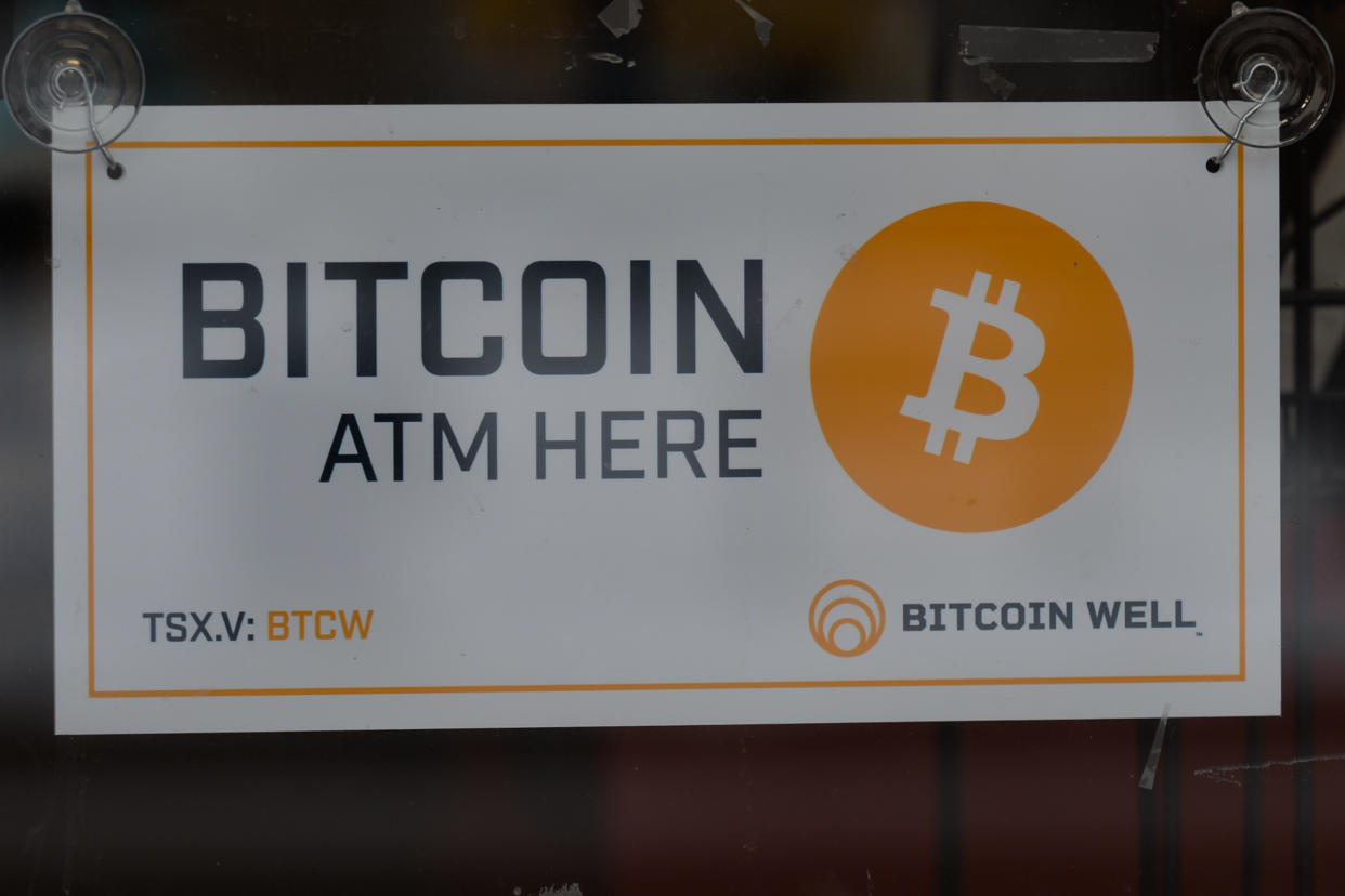 A sign 'Bitcoin ATM Here' seen on the door of a store on Whyte Avenue in Edmonton.
Monday, December 13, 2021, in Edmonton, Alberta, Canada. (Photo by Artur Widak/NurPhoto via Getty Images)