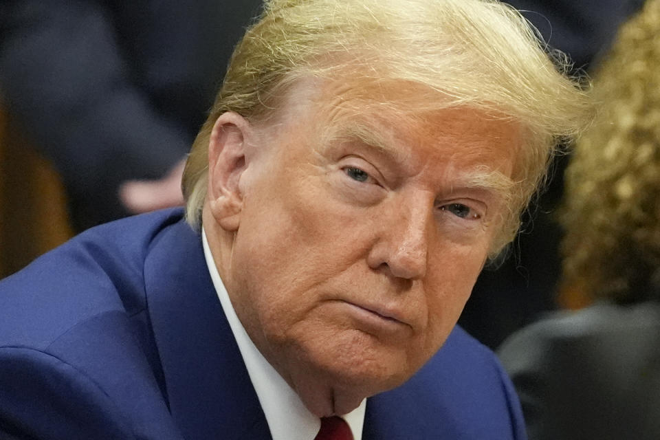 Former President Donald Trump awaits the start of a pre-trial hearing with his defense team at Manhattan criminal, Monday, March 25, 2024, in New York. A judge will weigh on Monday when the former president will go on trial. (AP Photo/Mary Altaffer, Pool)