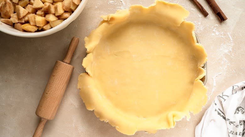 Uncooked pie crust in a pie dish