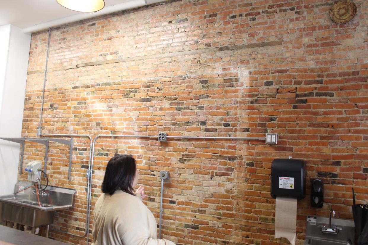 The Crunchy Pickle owner Dena Rheaume shows where the menu will be displayed in her new place located at 116 N. State St. in downtown Howell on Friday, Feb. 3, 2023.