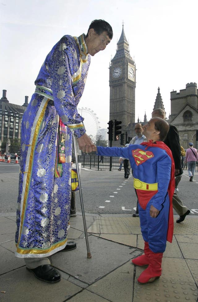 Xi Shun, 7ft 8.59in, with Kiran Shah, who is the shortest professional stuntman in the world