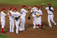 ARLINGTON, TX - OCTOBER 23: The Texas Rangers celebrate after defeating the St. Louis Cardinals 4-0 in Game Four of the MLB World Series at Rangers Ballpark in Arlington on October 23, 2011 in Arlington, Texas. (Photo by Doug Pensinger/Getty Images)