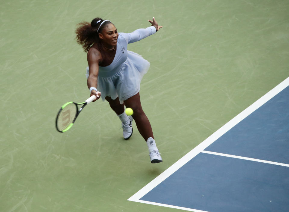 Serena Williams returns a shot to Kaia Kanepi, of Estonia, during the fourth round of the U.S. Open tennis tournament, Sunday, Sept. 2, 2018, in New York. (AP Photo/Andres Kudacki)