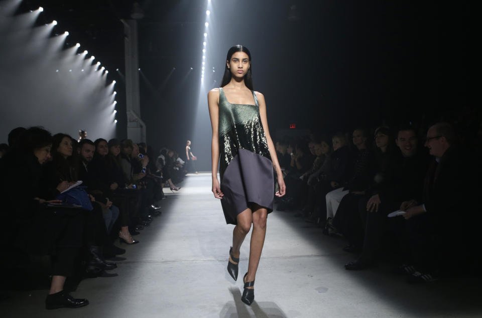 A model walks the runway during the showing of the Narciso Rodriguez Fall 2014 collection at Fashion Week in New York, Tuesday, Feb. 11, 2014. (AP Photo/Kathy Willens)