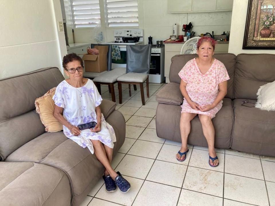 Maria de Jesus Medina, 83, and her daughter, Jesusa Vilches, 60, sit in their home in the Ariel neighborhood of Comerío, Puerto Rico, on Wednesday.