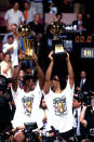 <p>1999: David Robinson #50 holds up the NBA Championship trophy as Tim Duncan #21 of the San Antonio Spurs holds up the MVP after winning Game Five of the 1999 NBA Finals at Madison Square Garden on June 25, 1999 in New York City, New York.</p>
