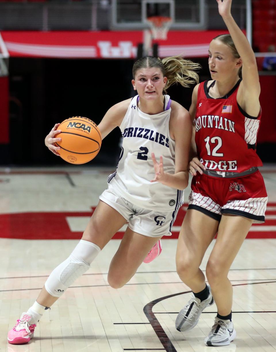 Copper Hills’ Ellie Taylor dribbles as Mountain Ridge’s Kaylee Montgomery guards her during a 6A girls quarterfinal basketball game at the Huntsman Center in Salt Lake City on Monday, Feb. 26, 2024. Copper Hills won 49-31. | Kristin Murphy, Deseret News