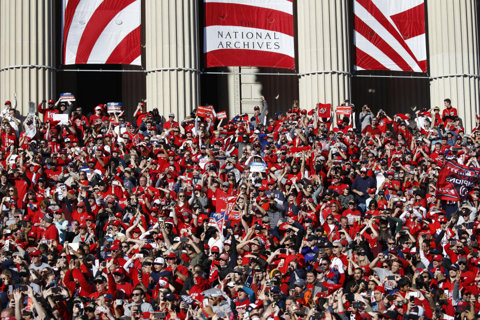 Washington Nationals fans gather on the steps of the National Archives during a parade to celebrate the team's World Series baseball championship over the Houston Astros, Saturday, Nov. 2, 2019, in Washington. (AP Photo/Patrick Semansky)