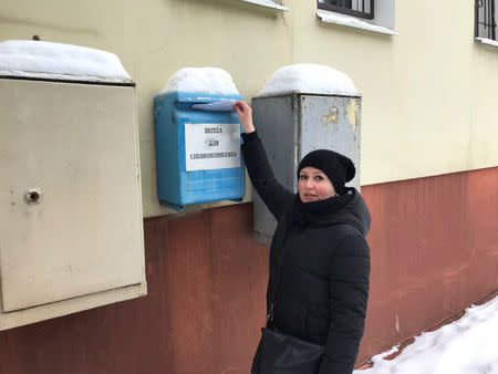 Irina Christensen, wife of Dennis Christensen, who is a Jehovah's Witness accused of extremism, poses for a picture while posting a letter to her husband at a detention centre in the town of Oryol, Russia January 15, 2019. REUTERS/Andrew Osborn