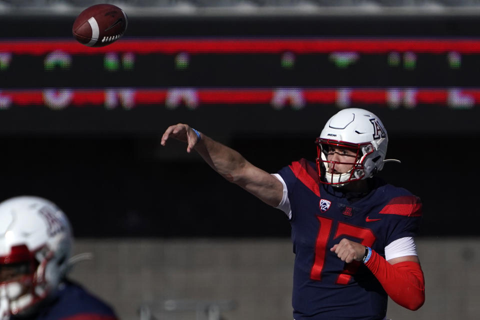 Arizona quarterback Grant Gunnell (17) throws downfield against Southern California in the first half during an NCAA college football game, Saturday, Nov. 14, 2020, in Tucson, Ariz. (AP Photo/Rick Scuteri)