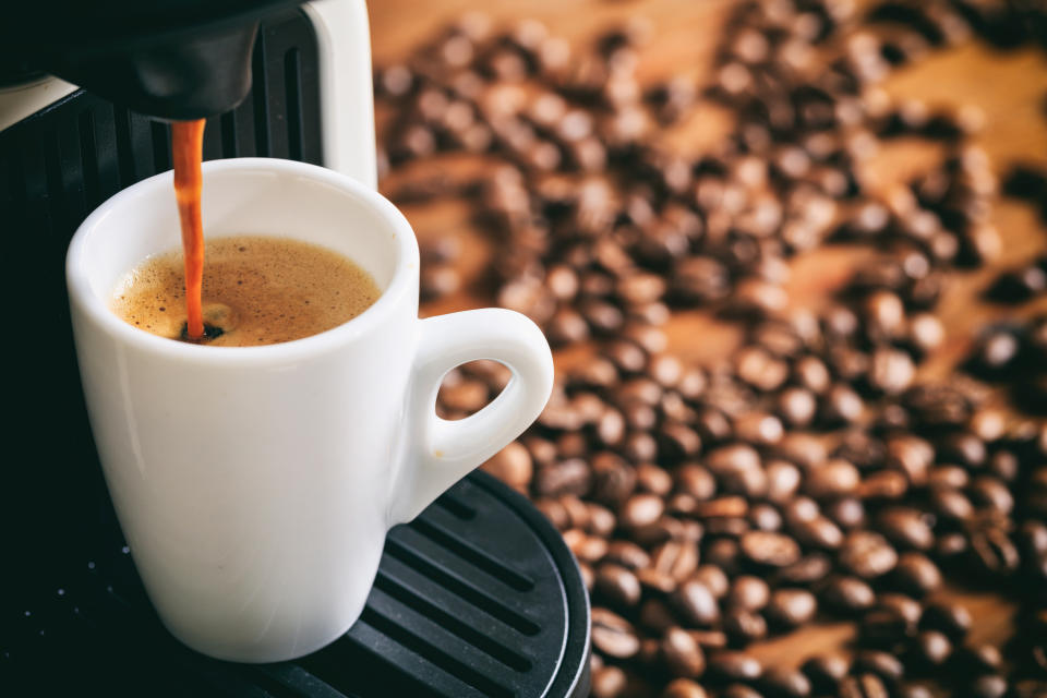 Espresso coffee preparation on a wooden table