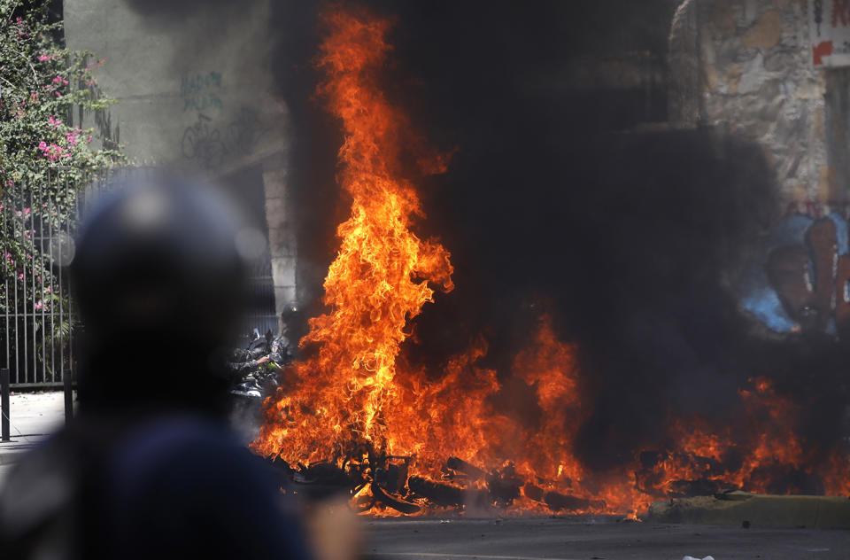 <p>Motorcycles burn after clashes broke out while the Constituent Assembly election was being carried out in Caracas, Venezuela, July 30, 2017. (Carlos Garcia Rawlins/Reuters) </p>