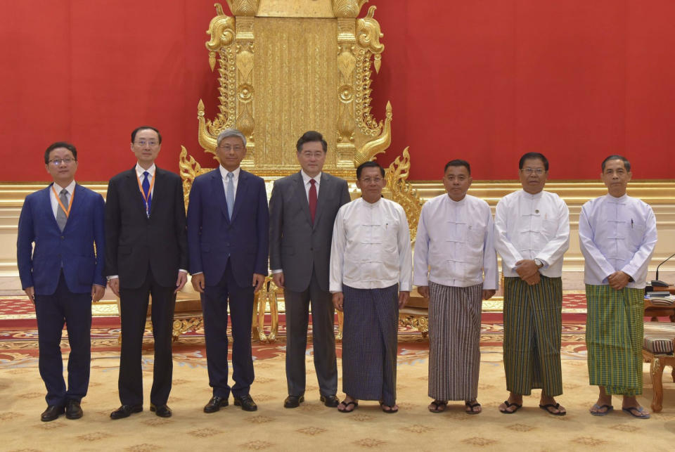 In this photo provided by the Myanmar Military True News Information Team, Senior Gen. Min Aung Hlaing, center right, head of the military council, poses for photos with Chinese Foreign Minister Qin Gang, center left, during their meeting Tuesday, May 2, 2023, in Naypyitaw, Myanmar.The head of Myanmar's military-controlled government, Senior Gen. Min Aung Hlaing, met Tuesday with the visiting foreign minister of China, one of the army regime's closest allies offering key support to its continued rule since seizing power two years ago. (Military True News Information Team via AP)