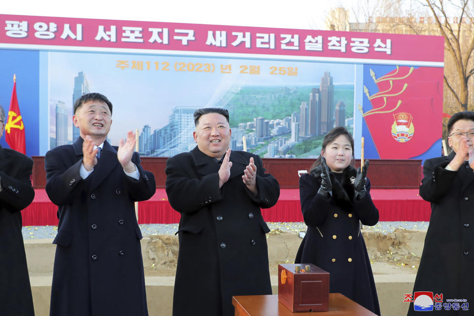This photo provided by the North Korean government shows North Korean leader Kim Jong Un, center left, and his daughter, center right, attend the groundbreaking ceremony of a project to build new homes in the Sopho district of Pyongyang, in North Korea, on Feb. 25, 2023. Independent journalists were not given access to cover the event depicted in this image distributed by the North Korean government. The content of this image is as provided and cannot be independently verified. Korean language watermark on image as provided by source reads: "KCNA" which is the abbreviation for Korean Central News Agency. (Korean Central News Agency/Korea News Service via AP)
