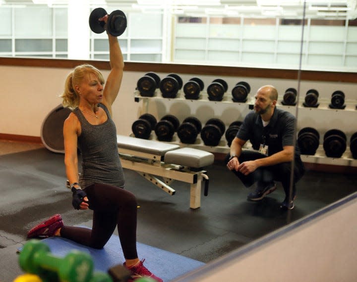 Myriam Haslinger of Bath works with personal trainer Scott Crabiel at Cleveland Clinic Akron General Health and Wellness Center. Myriam has been working out with Scott for nearly 15 years.