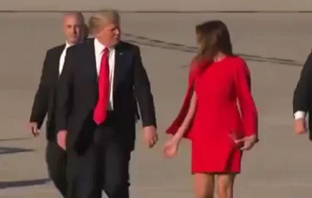 Trump shares an cringeworthy moment with his wife as he publicly rejects her attempts to hold hands. Photo: Youtube