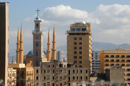 Saint George Maronite Cathedral's new bell tower is pictured near al-Amin mosque in downtown Beirut, Lebanon November 17, 2016. REUTERS/Mohamed Azakir