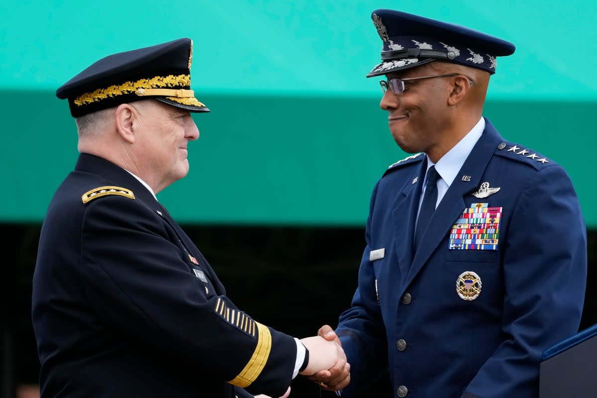 Retiring Chairman of the Joint Chiefs of Staff Gen. Mark Milley, left, shakes hands with Gen. Charles Q Brown Jr, the incoming chairman (Copyright The Associated Press. All rights reserved.)