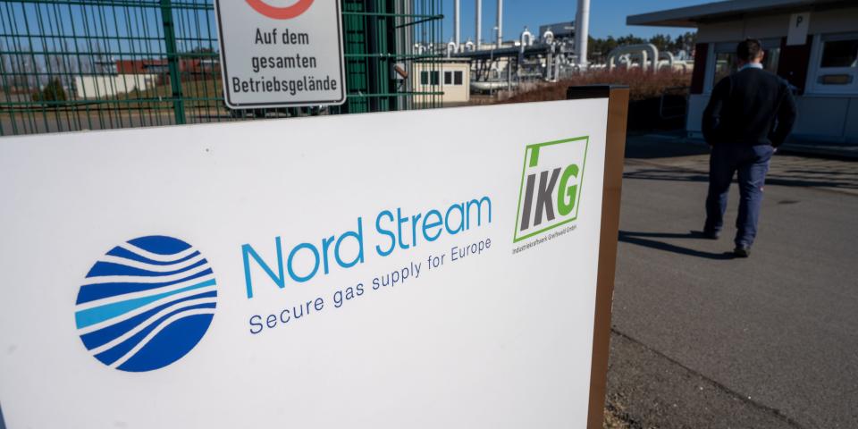 A sign with the words "Nord Stream" stands in front of the gas receiving station of the Nord Stream 1 Baltic Sea pipeline and the transfer station of the OPAL long-distance gas pipeline.