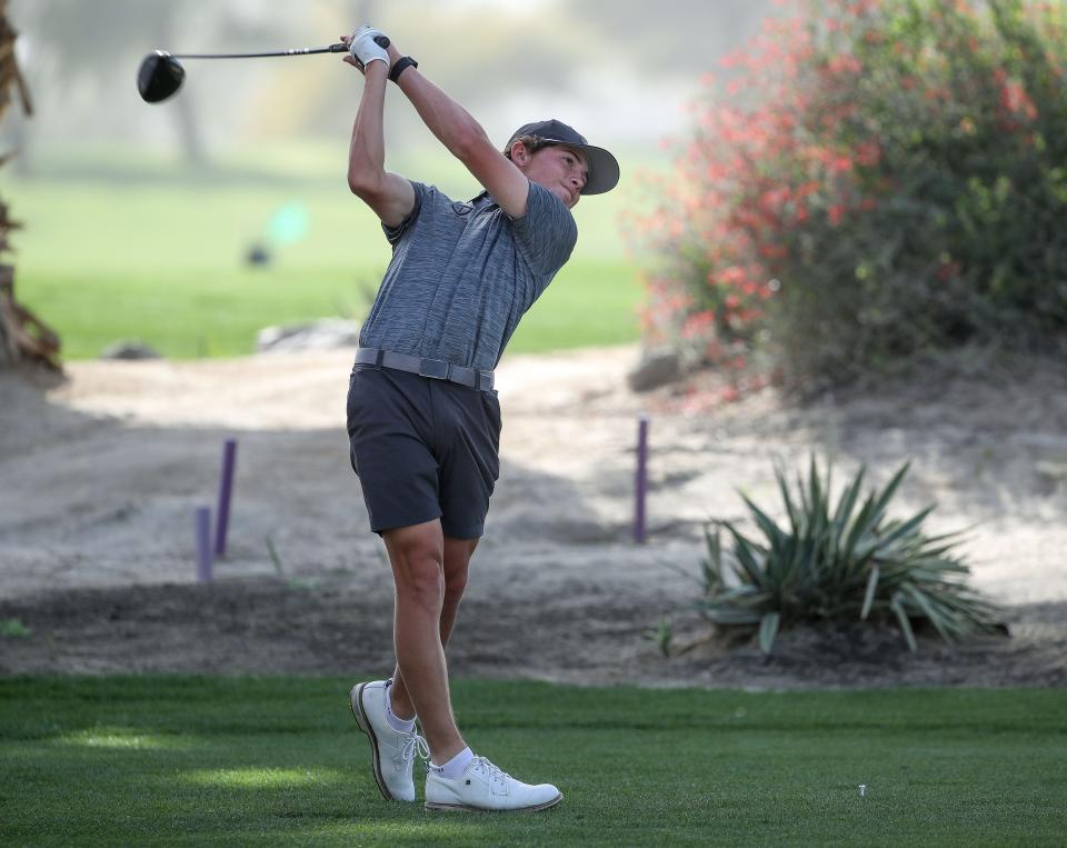 Benton Sullivan of the Xavier Prep High School golf team tees off on the first hole at Desert Willow Golf Resort in Palm Desert, Calif., Feb. 29, 2024.