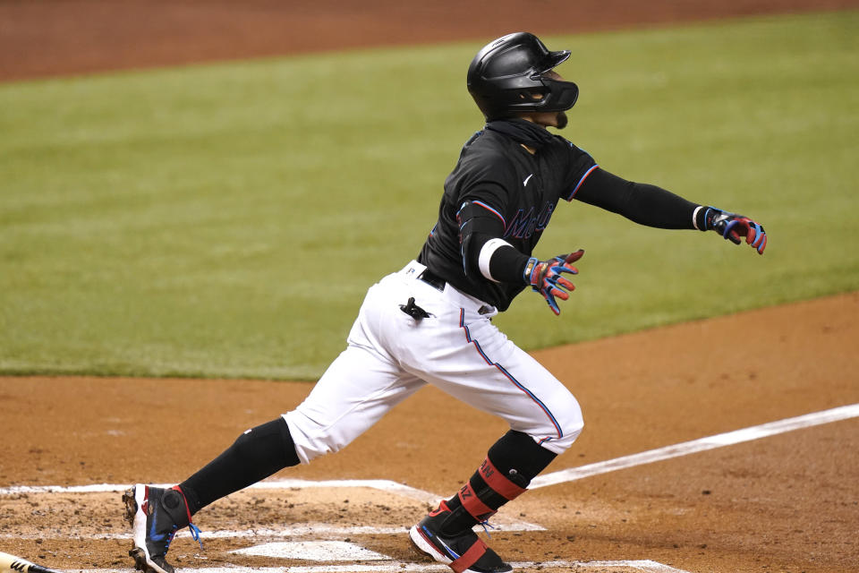 Miami Marlins' Isan Diaz watches after hitting as grand slam during the third inning of a baseball game against the Milwaukee Brewers, Friday, May 7, 2021, in Miami. (AP Photo/Lynne Sladky)