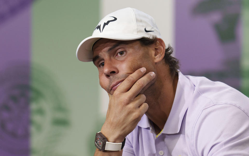 Spain's Rafael Nadal announces that he is withdrawing from the semi-final of the Gentlemen's Singles during a press conference at The All England Lawn Tennis Club, Wimbledon, Thursday, July 7, 2022. Rafael Nadal withdrew from Wimbledon on Thursday because of a torn abdominal muscle, announcing his decision a day before he was supposed to play in the semifinals. (Joe Toth/Pool Photo via AP)