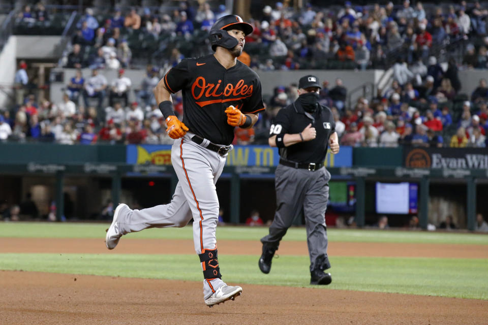 Baltimore Orioles' Rio Ruiz rounds the bases after hitting a home run during the fourth inning of the team's baseball game against the Texas Rangers in Arlington, Texas, Friday, April 16, 2021. (AP Photo/Roger Steinman)