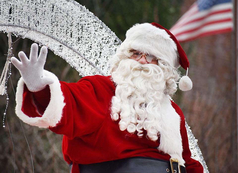 Santa waves to the crowd at the annual Children's Holiday Parade in Fall River Saturday, Dec. 4, 2021.