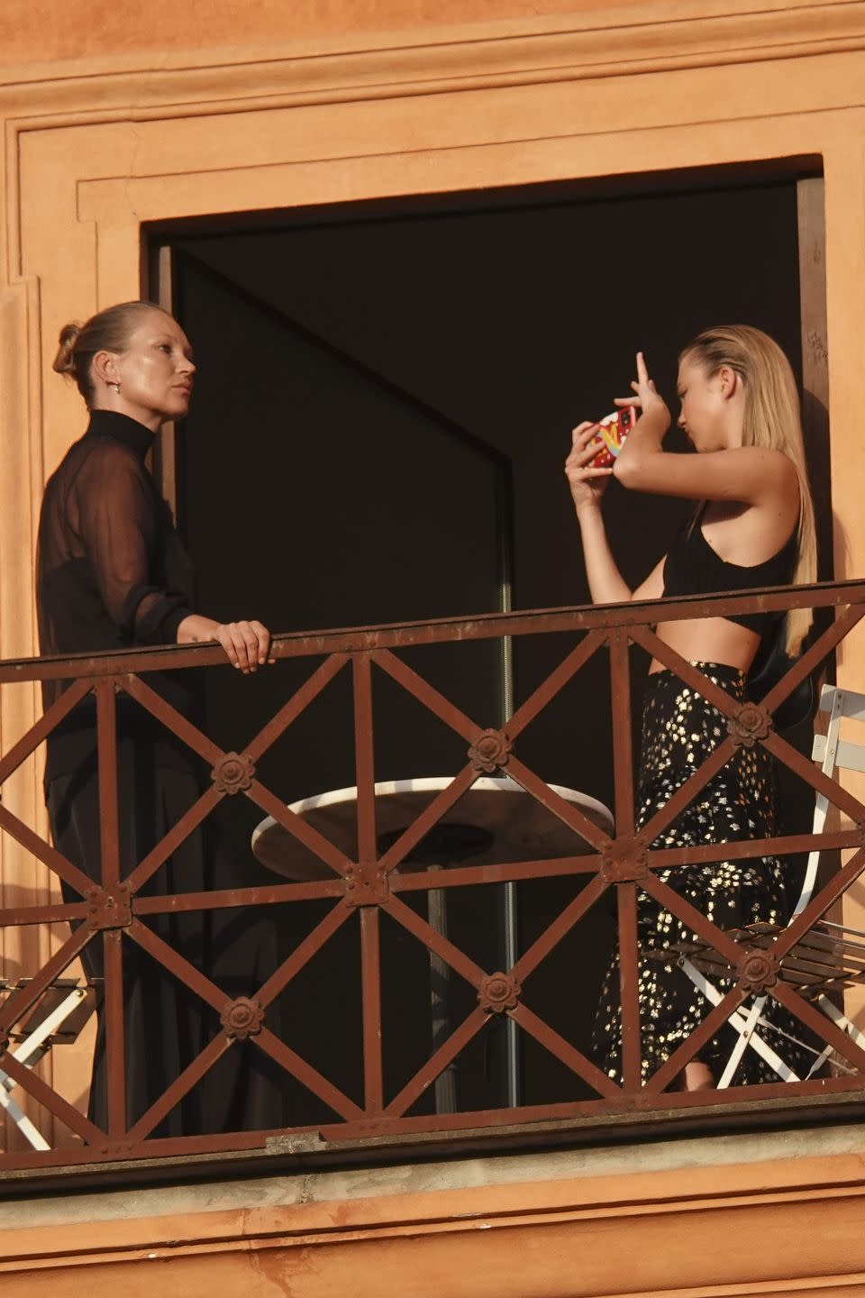 <p>If we’re talking about famous mother-daughter duos, these two take the cake. Kate and daughter, Lila Grace Moss-Hack, were spotted on a balcony in Rome, Italy, in 2021. Kate poses in a chic all-black look, while Lila snaps her mother’s photo in a black crop top and printed maxi skirt. We all need a supportive photographer in our lives! The two have attended the Met Gala, sat front row at Dior shows, and Lila is even following in her mom’s modeling footsteps. She is signed by her mother’s modeling agency, Kate Moss Agency.</p>