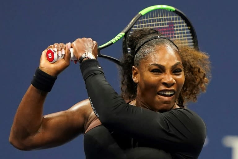 Sister act: Serena Williams on the way to a US Open third-round victory over her sister Venus